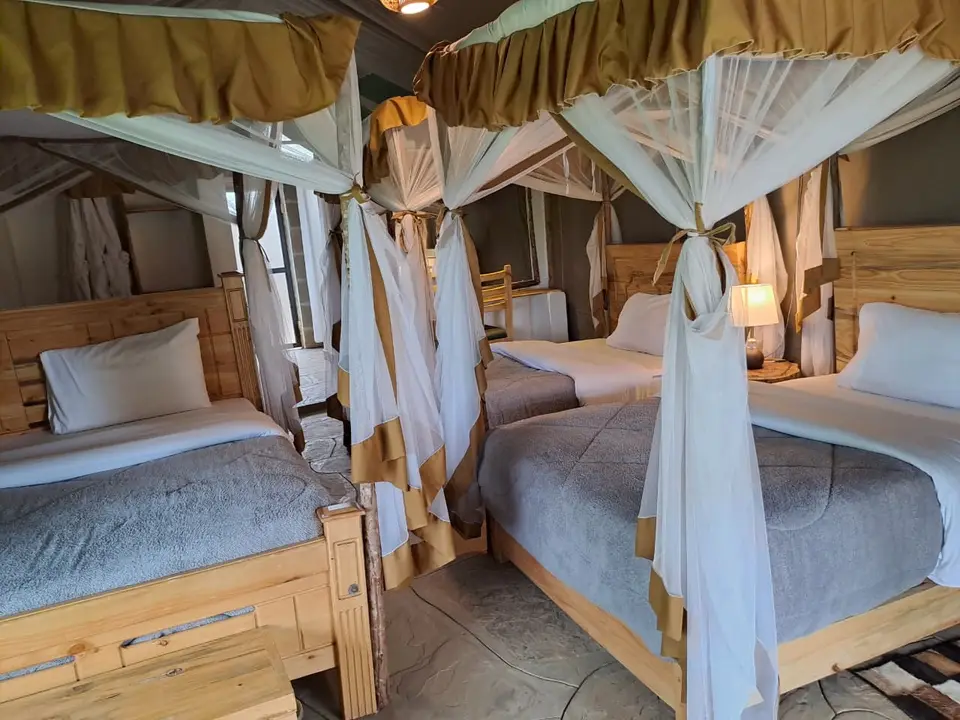 Spacious family tent with several canopied beds