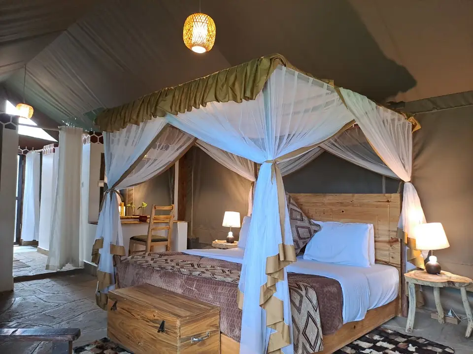 King canopy bed inside an executive tented suite